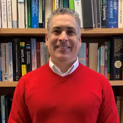 A portrait of John Paccione.