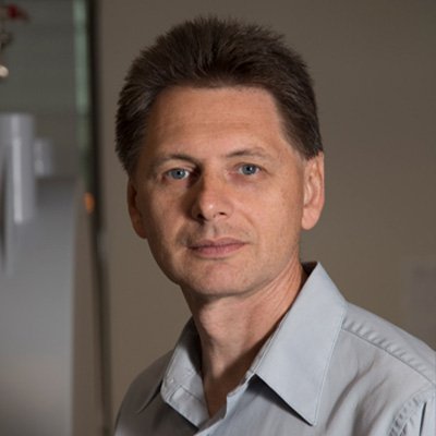 Vladimir Ermolenkov in a gray collared shirt