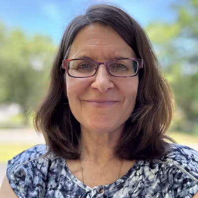 Dr. Heta-Maria Miller smiling outdoors