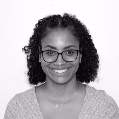 Amanda Delacruz, wearing glasses 