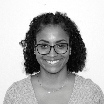 Amanda Delacruz, wearing glasses 