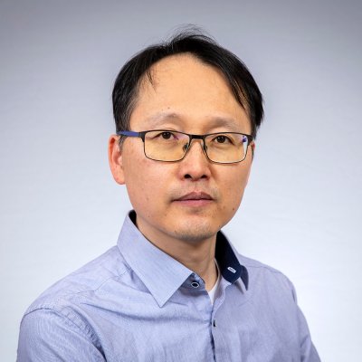 Bum Kyu smiles at the camera.