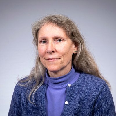 Kathleen smiles at the camera.