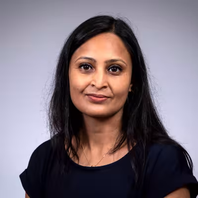 Pallavi smiles at the camera.