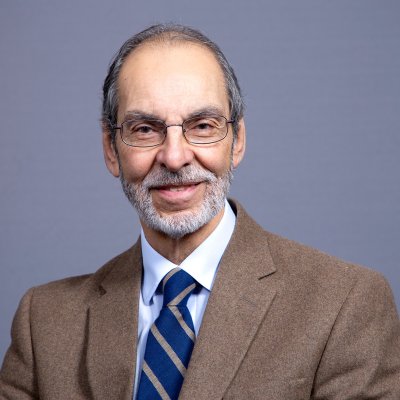 Dr. Altone smiles at the camera.