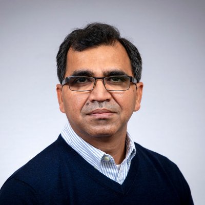 Anil looks at the camera.