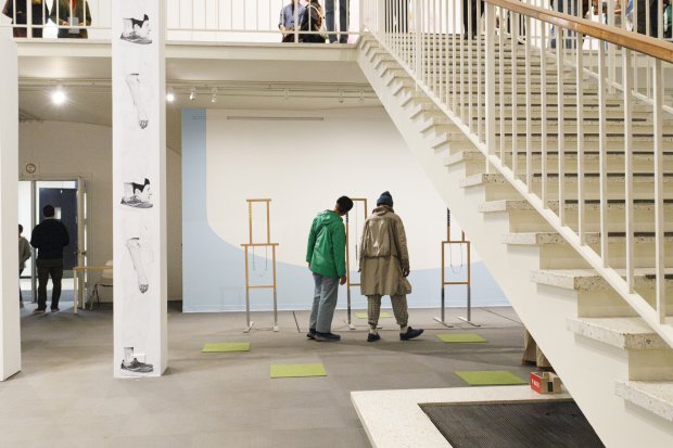 Two visitors in the museum looking at a sculpture display