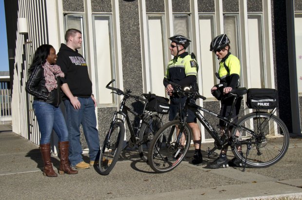 UPD bike patrol engaging in conversation with students 