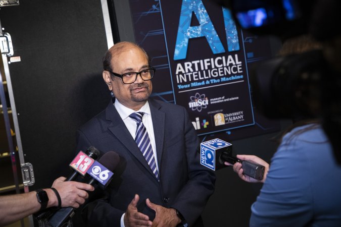 UAlbany VPRED Kesh Kesavadas speaks with reporters at the Museum of Innovation and Science in Schenectady during a launch of a summer-long exhibit on artificial intelligence.