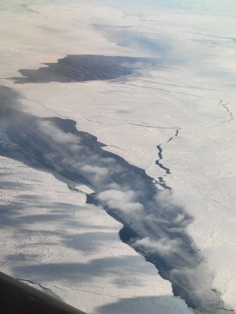Researchers share a photo from an aircraft high in the clouds over the Arctic region.