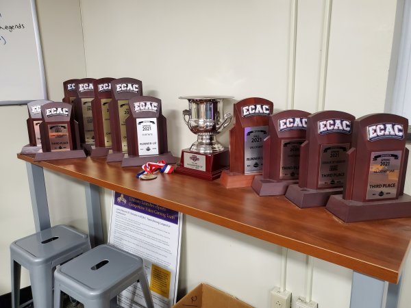 ECAC trophies lined up inside of UAlbany's competitive video gaming arena.