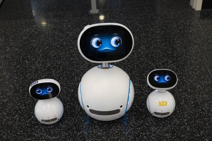 A family of Zenbo home robots look toward the camera.