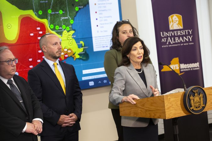 New York Governor Kathy Hochul stands behind the podium inside UAlbany's Ops Command Center at ETEC.