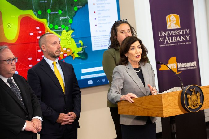 New York Governor Kathy Hochul stands behind the podium inside UAlbany's Ops Command Center at ETEC.
