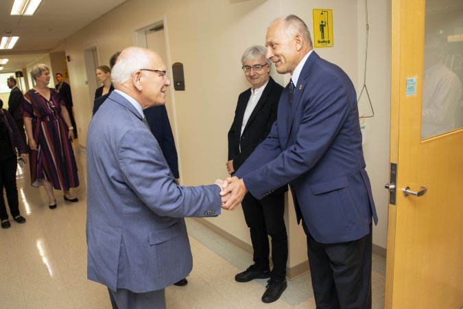 Igor Lednev meets with Congressman Paul Tonko outside of his lab at the Life Sciences building.
