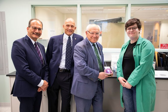 President Rodriguez, Distinguished Professor of Chemistry Igor Lednev, Congressman Tonko and a UAlbany student researcher stand together for a photo inside the Lednev lab. 
