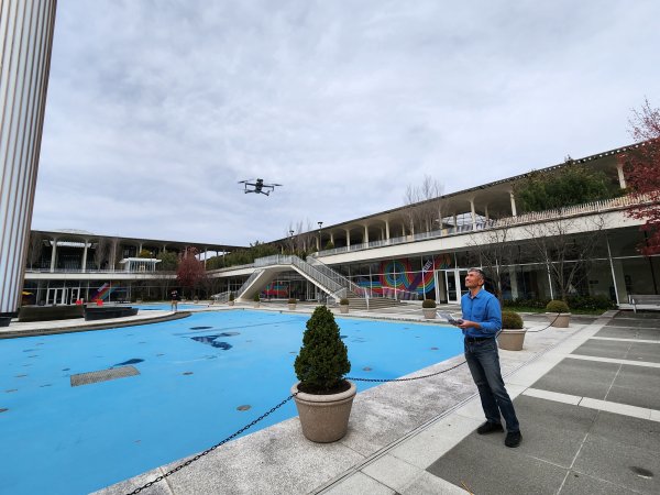 Alexander Buyantuev, an associate professor in the Department of Geography and Planning, flies a DJI Mavic 2 Enterprise drone over the UAlbany main fountain.