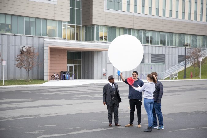 UAlbany students prepare for a weather balloon launch with Al Roker from the ETEC parking lot.