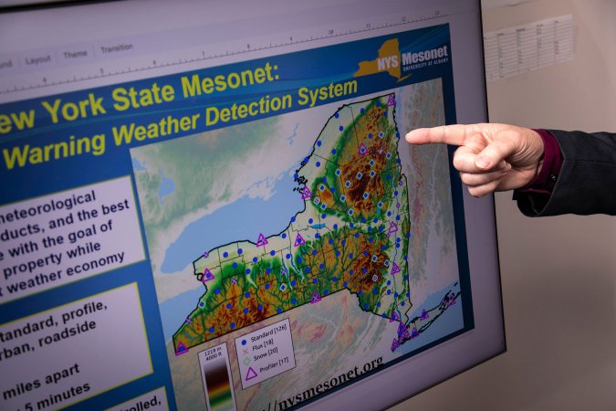 A finger points at a New York State Mesonet map.