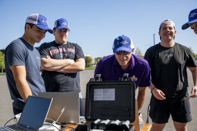 Jeff Freedman and students review weather balloon data in real time from the ETEC parking lot.