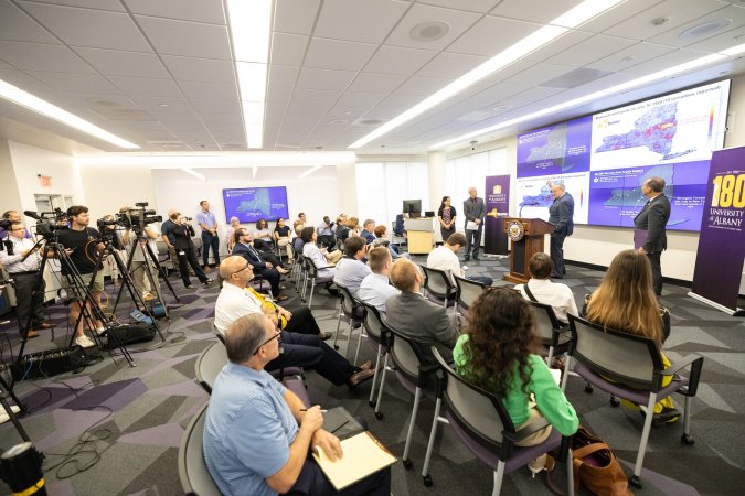 Senator Schumer speaks to a group sitting inside the CEHC Ops Command Center.