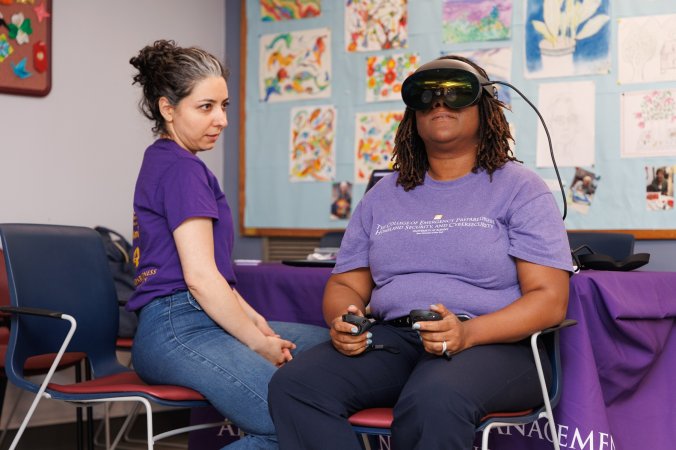 Mahsa Goodarzi and DeeDee Bennett Gayle test out their VR headset tool from Brooklyn.