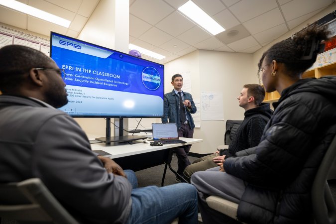 CEHC's Ariel Pinto instructs students from inside the Cyber Cascade Risk lab.