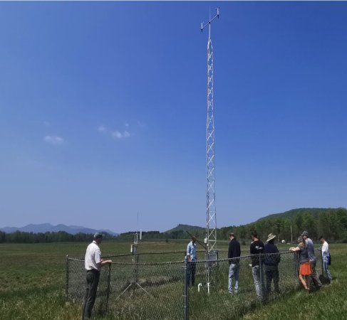 Mesonet researchers visit the weather tower located on Uihlein Farm in Lake Placid.