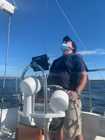 Gonzalez-Cruz steers a boat in the ocean.
