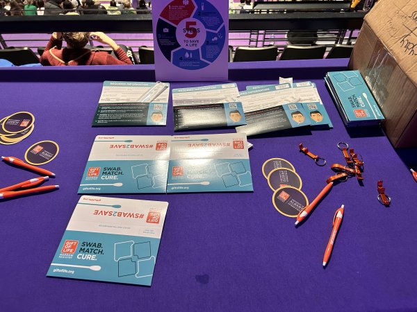 Gift of Life swab kits on a purple table inside the Broadview Center at UAlbany.