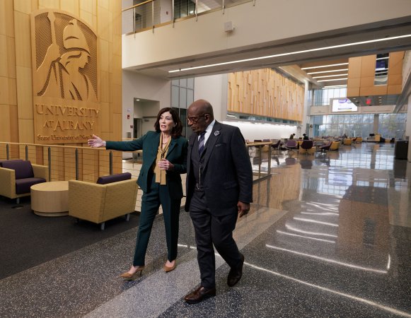 Gov. Hochul and Al Roker walk through the ETEC atrium.