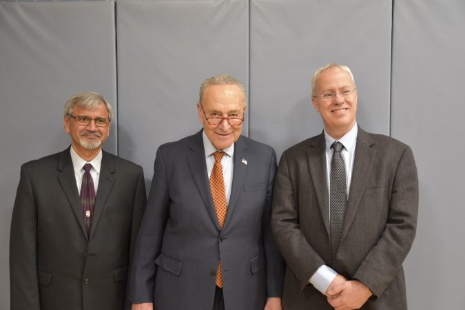 Sen. Schumer stands with NYS Mesonet Director Chris Thorncroft and UAlbany Associate Vice President for Research Satyendra Kumar.