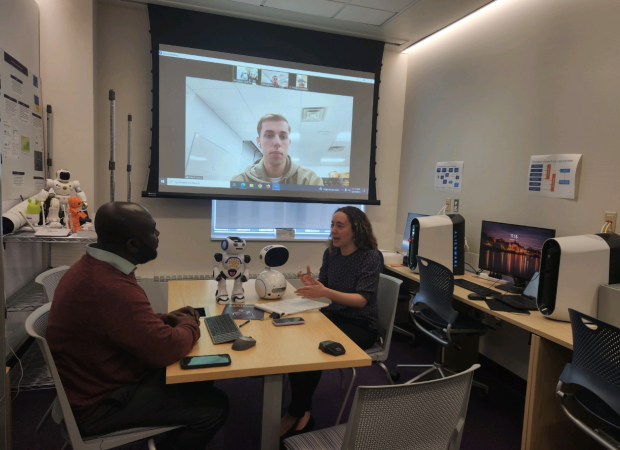 Fiona Hernandez speaking with Dr. Benjamin Yankson and his students