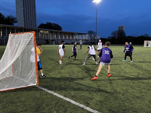 UAlbany students and Special Olympics athletes compete in a soccer match under the lights at Dutch Turf.