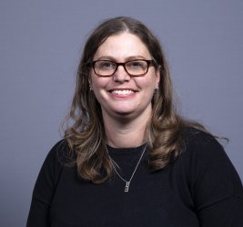 Dr. de Long smiles at the camera.