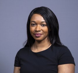 Dr. Adeyeye smiles at the camera.