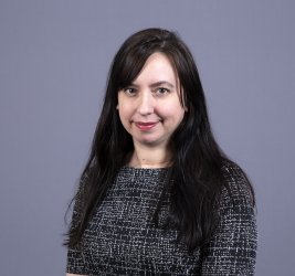 Dr. Melissa Tracy smiles at the camera.