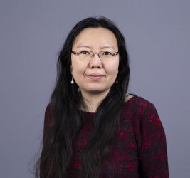 Dr. Xiaobo Xue Romeiko smiles at the camera.