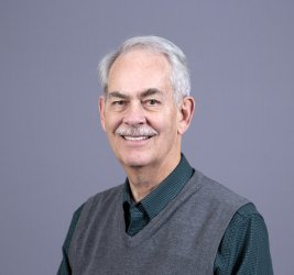 Dr. Smith smiles at the camera.