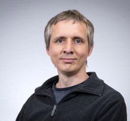 Joseph smiles at the camera.