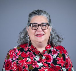 Cate smiles at the camera.