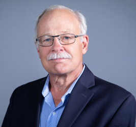 Gus smiles at the camera.