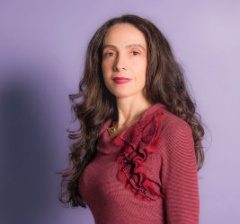 Roxana smiles at the camera.