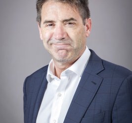 Doug smiles at the camera.