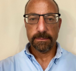 A portrait of James Tesoriero.