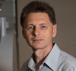 Vladimir Ermolenkov in a gray collared shirt