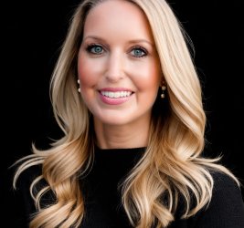 Kelly Wissman portrait smiling long blonde hair, black top