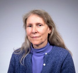 Kathleen smiles at the camera.