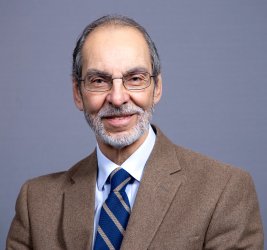 Dr. Altone smiles at the camera.