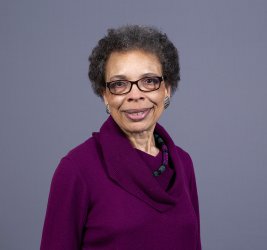 Annette smiles at the camera.